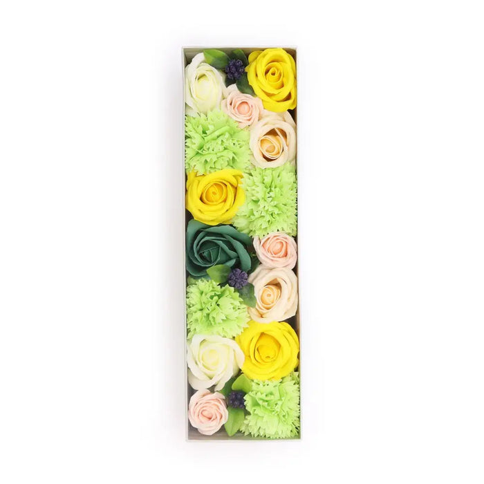 A rectangular soap flower gift box filled with colorful yellow green pink white and purple soap flowers for spring celebrations