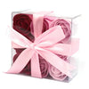 Pink and deep red rose shaped soap flowers in a clear box tied with a soft pink satin ribbon bow set of 9