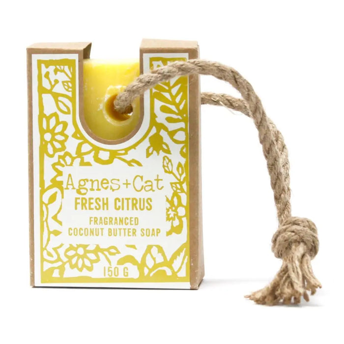 A yellow agnes cat fresh citrus fragranced coconut butter soap bar in a floral cardboard box with twine rope