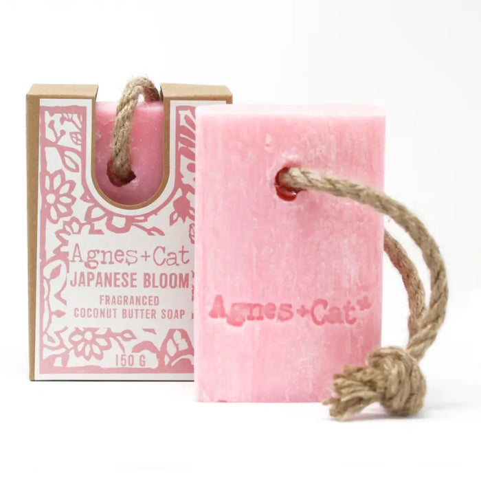 Pink rectangular bar of agnes cat japanese bloom fragranced coconut butter soap with natural twine rope loop for hanging