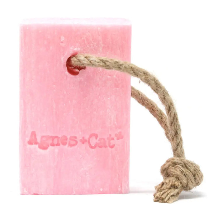 Pink rectangular soap on a rope with natural twine branded agnes plus cat scented japanese bloom