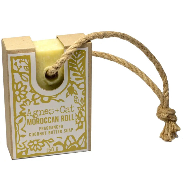 A pale yellow rectangular bar of agnes+cat moroccan roll fragranced coconut butter soap with a natural twine rope