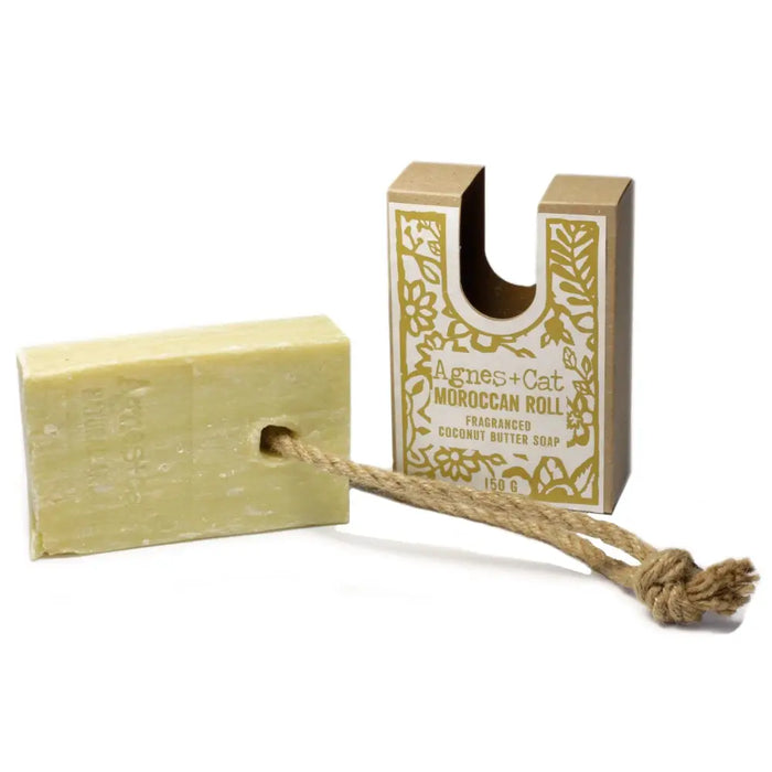 A pale green rectangular agnes cat moroccan roll soap on a rope with natural twine for hanging made of coconut butter