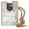 A dark gray rectangular soap on a rope made of coconut butter with sea salt and moss fragrance and natural twine loop