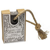 A dark gray textured soap bar of agnes+cat sea salt and moss fragranced coconut butter soap in a rustic floral box