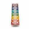 Rainbow-colored soapstone incense holder with seven white chakra symbols on distinct colored bands
