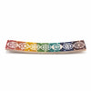 Soapstone incense holder with rainbow colors and seven white chakra symbols engraved for soapstone incense use