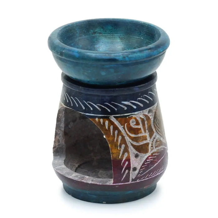 Soapstone oil burner with hand carved dark base and teal blue bowl featuring white floral etched patterns