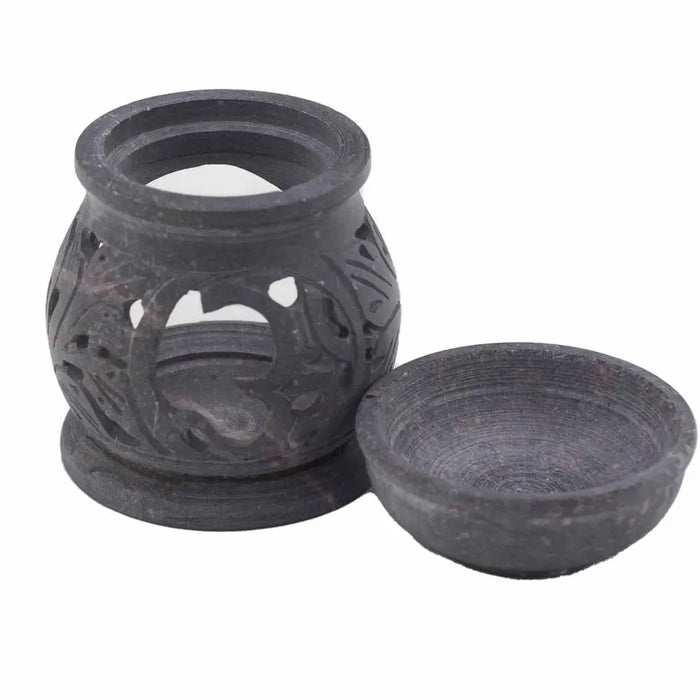 Dark gray soapstone oil diffuser with carved floral patterns and matching bowl for burning oil with om symbol design