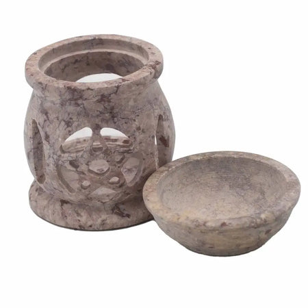 A beige and gray soapstone oil burner with a three moon pentagon cutout design and matching bowl for aromatherapy