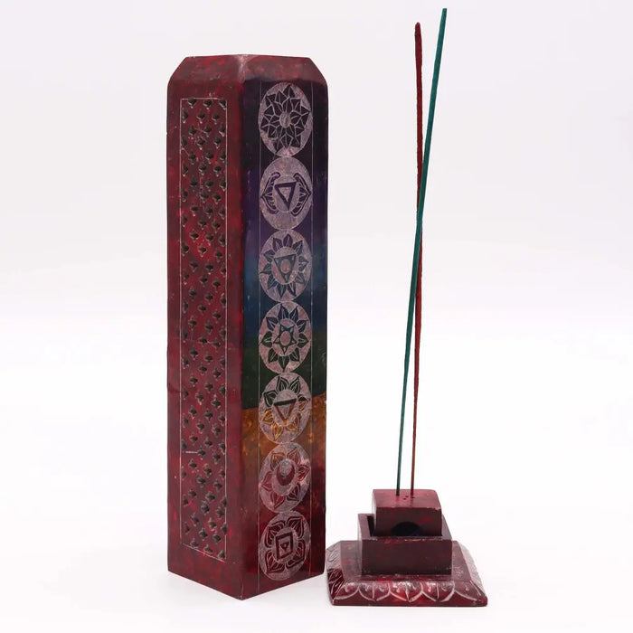 Deep red soapstone tower incense holder with chakra carvings and square stand holding two colored incense sticks