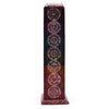 A tall rectangular multi-colored resin soapstone tower incense holder with seven chakra symbols etched on it