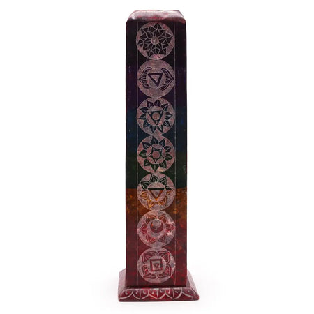 A tall rectangular multi-colored resin soapstone tower incense holder with seven chakra symbols etched on it