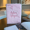 A soft pink fluffy notebook made of fabric with before i forget embroidered for a dream journal with 80 pages