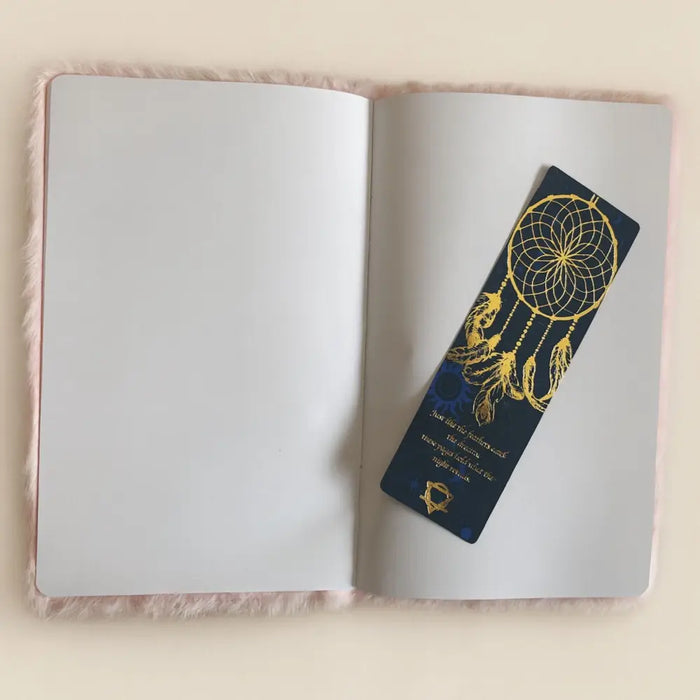 A navy blue dreamcatcher-themed bookmark with gold foil details and a small golden emblem for soft book dream journal
