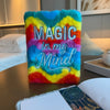 A soft rainbow-colored fluffy notebook with magic in my mind embroidered in silver thread for dream journaling