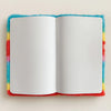 Soft book dream journal with rainbow fuzzy cover and blank white pages for magic ideas and thoughts