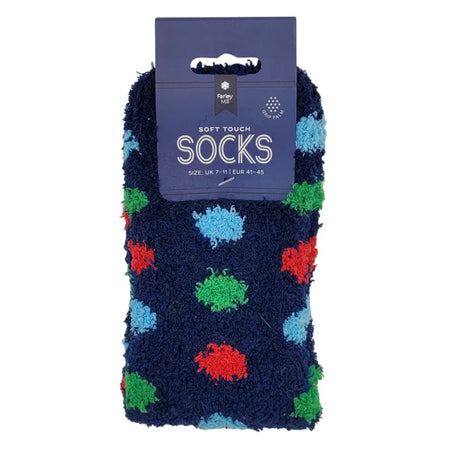 A pair of navy blue soft touch short socks with colorful fuzzy polka dots in red green and light blue