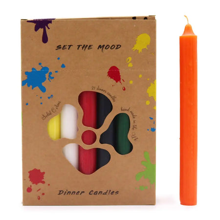 A solid colour dinner candle in vibrant orange with a smooth cylindrical body and slightly tapered top in a pack of 21
