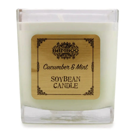A square glass jar holds a creamy white 5cm soy wax candle with a bamboo cucumber and mint label and black borders