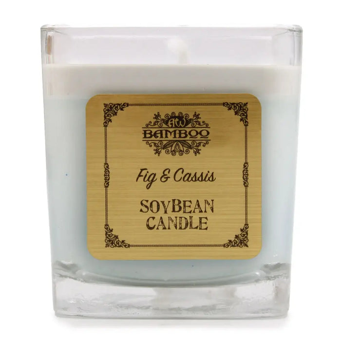 A 5cm square glass soy wax candle in light blue with an engraved bamboo label fig and cassis by bamboo