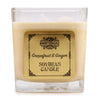 A square glass wax candle in creamy beige soy wax with a 5cm ornate bamboo label reading grapefruit and ginger
