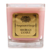 Pink pomegranate and orange soy wax candle in a clear 5cm square glass jar with an ornate gold label