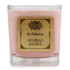 A pink 5cm soy wax jar candle in a clear glass container with a gold bamboo so delicious label