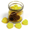 Yellow heart-shaped soy wax melts in a clear glass jar with a brown paper tag labeled brandy butter wax melts