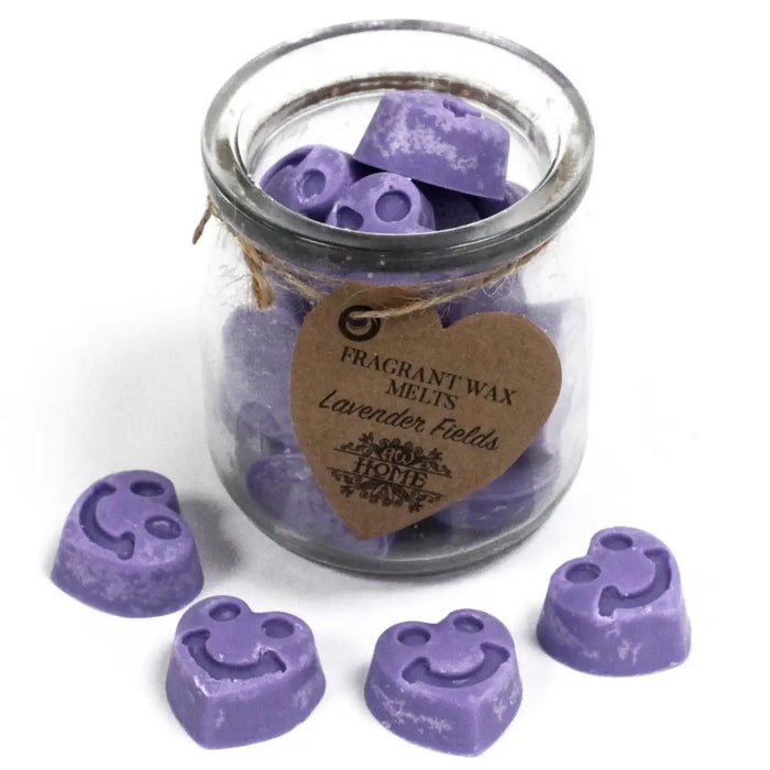 Purple smiley-faced lavender soy wax melts in a clear glass jar with a heart-shaped tag for home fragrance