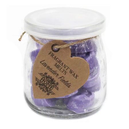 Purple lavender-scented soy wax melts in a clear glass jar with white lid and heart-shaped tag for wax melts use
