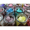 Colorful peachy cool soy wax melts shaped like mickey mouse in clear glass jars with twine and paper tags