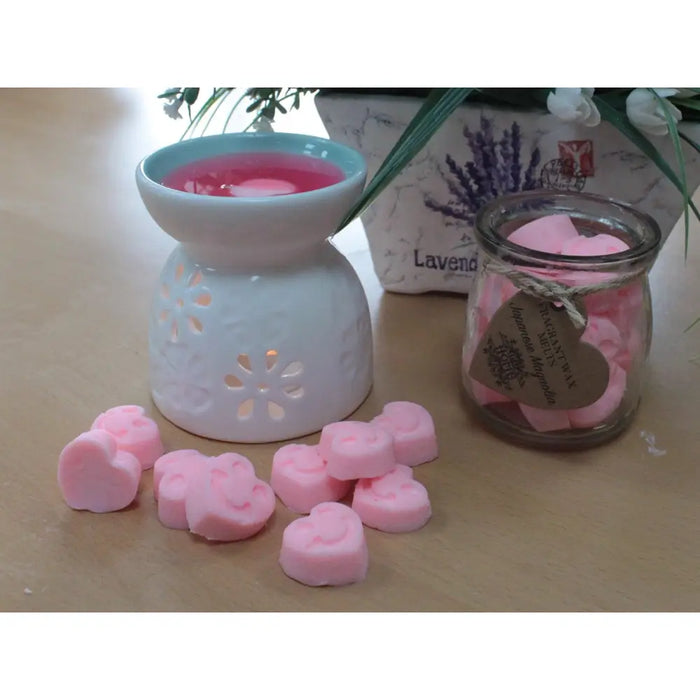 Pink heart-shaped lavender soy wax melts in a glass jar with rustic twine tag labeled peachy cool wax melts