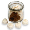 Heart-shaped white soy wax melts in a clear glass jar with a rustic brown tag scented with white musk