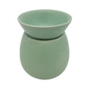 A mint green speckled ceramic stoneware oil burner from the spa collection with a rounded bowl on top