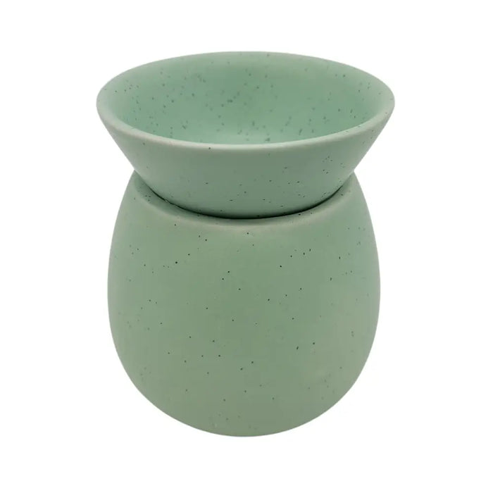 A mint green speckled ceramic stoneware oil burner from the spa collection with a rounded bowl on top