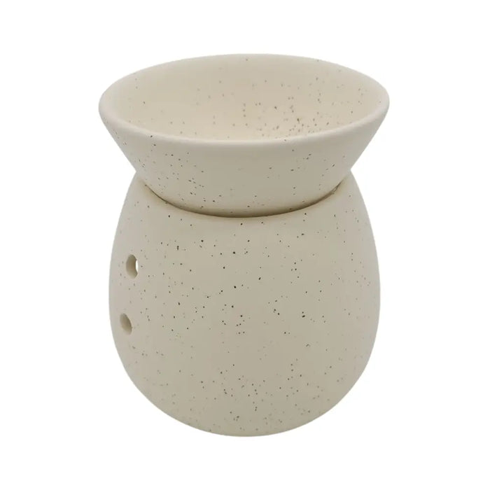 Cream-colored speckled ceramic spa collection stoneware oil burner with rounded bowl and small side ventilation holes