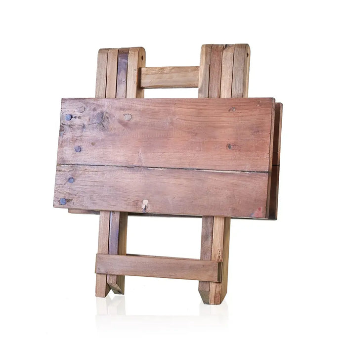 Rustic square folding coffee table in weathered teak wood with visible grain patterns and natural finish