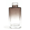 A sleek square reed diffuser bottle 100ml with a dark brown to clear gradient glass finish for bamboo reed diffuser use