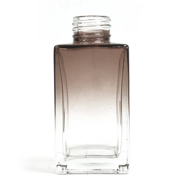 A sleek square reed diffuser bottle 100ml with a dark brown to clear gradient glass finish for bamboo reed diffuser use