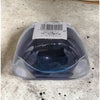 A translucent blue gel-filled silicone mold with a white label for a square two-tone glass tealight holder