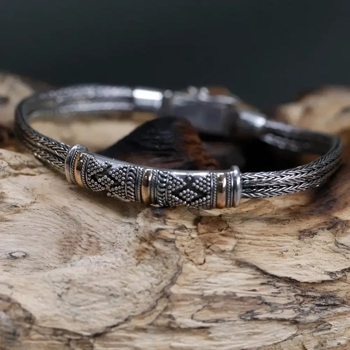 Sterling silver and 18ct yellow gold twin chain bracelet with braided design and diamond pattern on central clasp