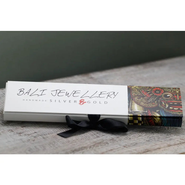White rectangular box with bali jewellery and handmade silver and gold text tied with black ribbon for sterling silver and 18ct yellow gold twin chain bracelet
