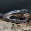 Sterling silver twin chain bracelet with ornate engraved clasp featuring scrollwork and 18ct yellow gold accents