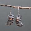 Sterling silver angel wings earrings with intricate filigree and 18ct yellow gold rose gold square accent stone