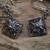 Square sterling silver earrings with intricate floral filigree and 18ct yellow gold accents in a classic square design