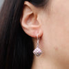 Silver dangle earring with ornate diamond-shaped sterling silver pendant and 18ct yellow gold classic square detail