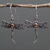 Sterling silver and 18ct yellow gold dragonfly earrings with intricate filigree wings and a copper bead center