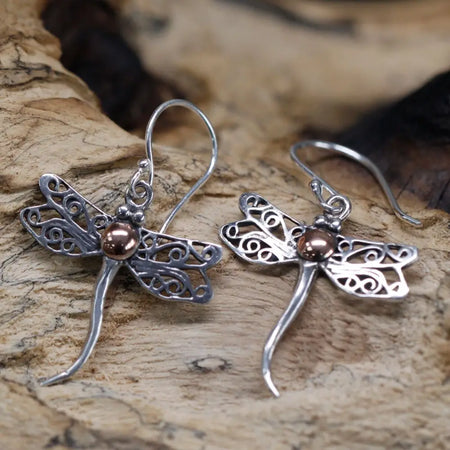 Silver dragonfly earrings with intricate filigree wings and a copper bead center in sterling silver and 18ct yellow gold