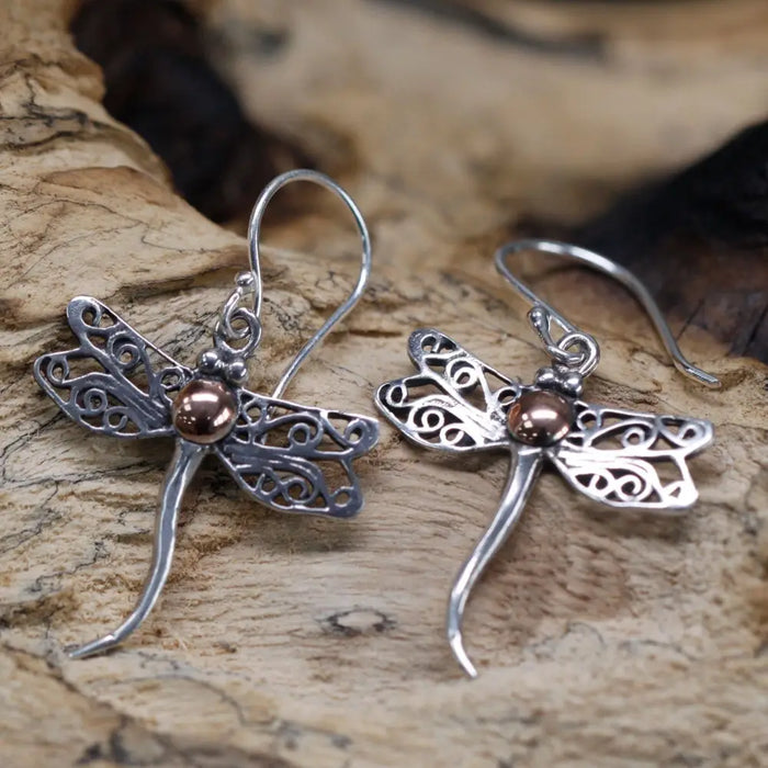 Silver dragonfly earrings with intricate filigree wings and a copper bead center in sterling silver and 18ct yellow gold